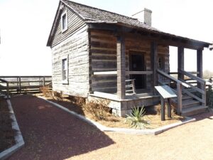 Susan Godsey and the Sleeping Beauty's Cabin donated to Discovery Park of America by the Eddie Hicks family of Fulton, Tennessee.
